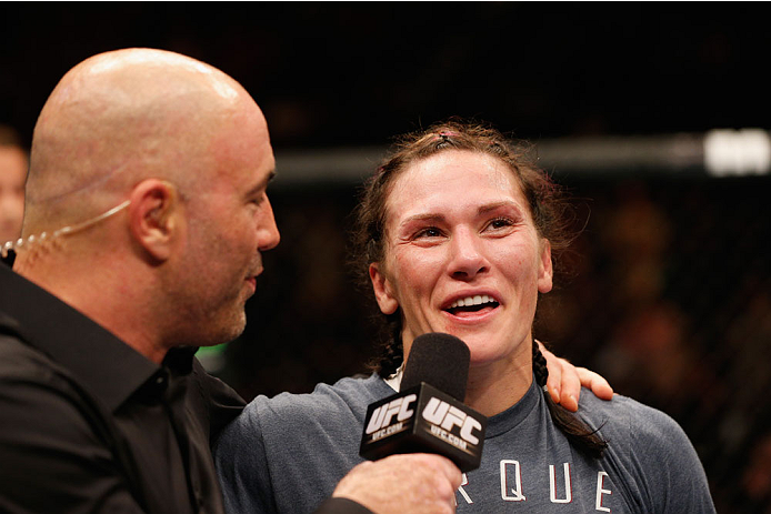LAS VEGAS, NV - SEPTEMBER 27: (R-L) Cat Zingano speaks with Joe Rogan after her win over Amanda Nunes in their women's bantamweight fight during the UFC 178 event inside the MGM Grand Garden Arena on September 27, 2014 in Las Vegas, Nevada. (Photo by Jo