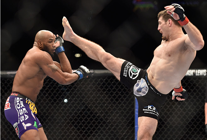 LAS VEGAS, NV - SEPTEMBER 27: (R-L) Tim Kennedy throws a kick at Yoel Romero in their middleweight fight during the UFC 178 event inside the MGM Grand Garden Arena on September 27, 2014 in Las Vegas, Nevada. (Photo by Jeff Bottari/Zuffa LLC/Zuffa LLC vi