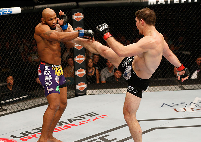 LAS VEGAS, NV - SEPTEMBER 27: (R-L) Tim Kennedy kicks Yoel Romero in their middleweight fight during the UFC 178 event inside the MGM Grand Garden Arena on September 27, 2014 in Las Vegas, Nevada. (Photo by Josh Hedges/Zuffa LLC/Zuffa LLC via Getty Imag