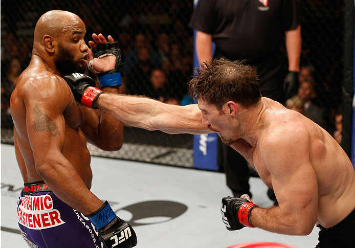 LAS VEGAS, NV - SEPTEMBER 27: (R-L) Tim Kennedy punches Yoel Romero in their middleweight fight during the UFC 178 event inside the MGM Grand Garden Arena on September 27, 2014 in Las Vegas, Nevada. (Photo by Josh Hedges/Zuffa LLC/Zuffa LLC via Getty Im