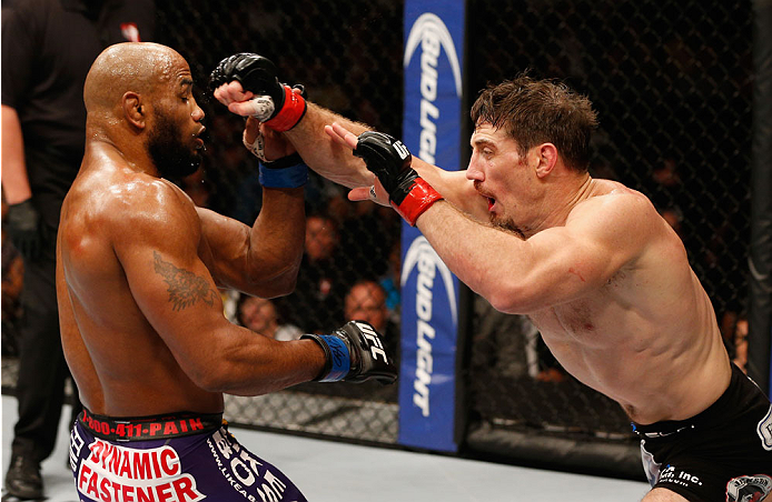 LAS VEGAS, NV - SEPTEMBER 27: (R-L) Tim Kennedy punches Yoel Romero in their middleweight fight during the UFC 178 event inside the MGM Grand Garden Arena on September 27, 2014 in Las Vegas, Nevada. (Photo by Josh Hedges/Zuffa LLC/Zuffa LLC via Getty Im