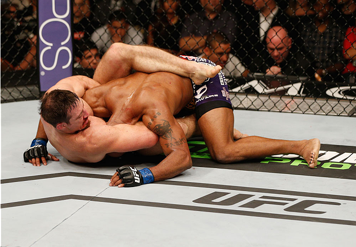 LAS VEGAS, NV - SEPTEMBER 27: (Bottom) Tim Kennedy attempts a submission on Yoel Romero in their middleweight fight during the UFC 178 event inside the MGM Grand Garden Arena on September 27, 2014 in Las Vegas, Nevada. (Photo by Josh Hedges/Zuffa LLC/Zu
