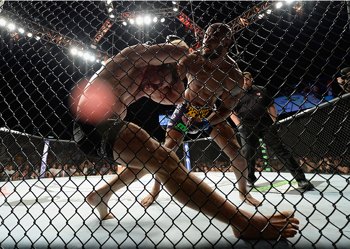 LAS VEGAS, NV - SEPTEMBER 27: (Top) Yoel Romero punches Tim Kennedy in their middleweight fight during the UFC 178 event inside the MGM Grand Garden Arena on September 27, 2014 in Las Vegas, Nevada. (Photo by Jeff Bottari/Zuffa LLC/Zuffa LLC via Getty I
