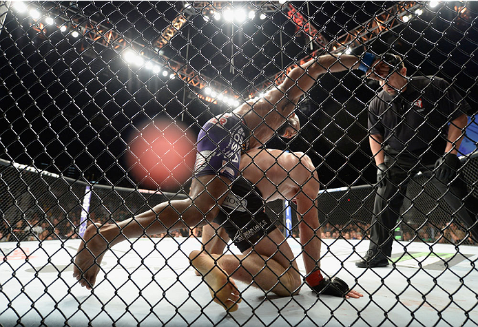 LAS VEGAS, NV - SEPTEMBER 27: (Top) Yoel Romero punches Tim Kennedy in their middleweight fight during the UFC 178 event inside the MGM Grand Garden Arena on September 27, 2014 in Las Vegas, Nevada. (Photo by Jeff Bottari/Zuffa LLC/Zuffa LLC via Getty I