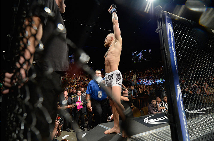 LAS VEGAS, NV - SEPTEMBER 27: Conor McGregor enters the Octagon before facing Dustin Poirier in their featherweight fight during the UFC 178 event inside the MGM Grand Garden Arena on September 27, 2014 in Las Vegas, Nevada. (Photo by Jeff Bottari/Zuffa
