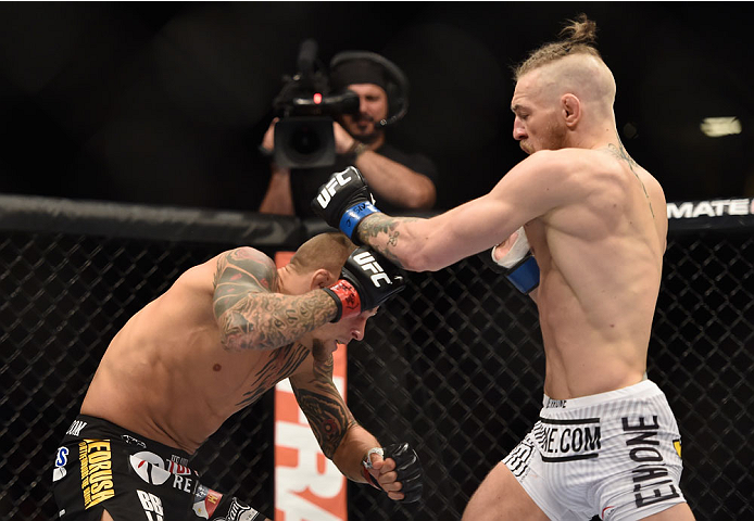 LAS VEGAS, NV - SEPTEMBER 27: (R-L) Conor McGregor punches Dustin Poirier in their featherweight fight during the UFC 178 event inside the MGM Grand Garden Arena on September 27, 2014 in Las Vegas, Nevada. (Photo by Jeff Bottari/Zuffa LLC/Zuffa LLC via