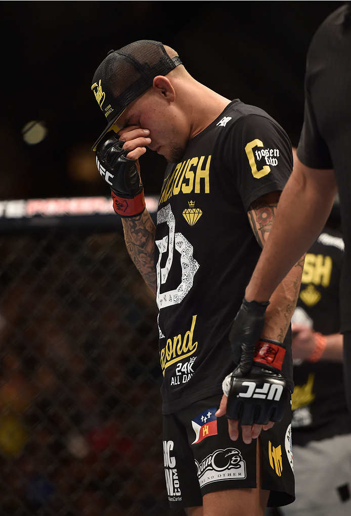 LAS VEGAS, NV - SEPTEMBER 27: Dustin Poirier reacts to his TKO loss to Conor McGregor in their featherweight fight with during the UFC 178 event inside the MGM Grand Garden Arena on September 27, 2014 in Las Vegas, Nevada. (Photo by Jeff Bottari/Zuffa L