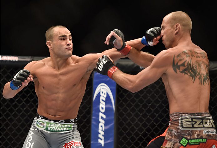 LAS VEGAS, NV - SEPTEMBER 27: (L-R) Eddie Alvarez punches Donald Cerrone in their lightweight fight during the UFC 178 event inside the MGM Grand Garden Arena on September 27, 2014 in Las Vegas, Nevada. (Photo by Jeff Bottari/Zuffa LLC/Zuffa LLC via Get