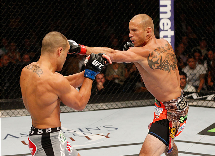 LAS VEGAS, NV - SEPTEMBER 27: (R-L) Donald Cerrone punches Eddie Alvarez in their lightweight fight during the UFC 178 event inside the MGM Grand Garden Arena on September 27, 2014 in Las Vegas, Nevada. (Photo by Josh Hedges/Zuffa LLC/Zuffa LLC via Gett
