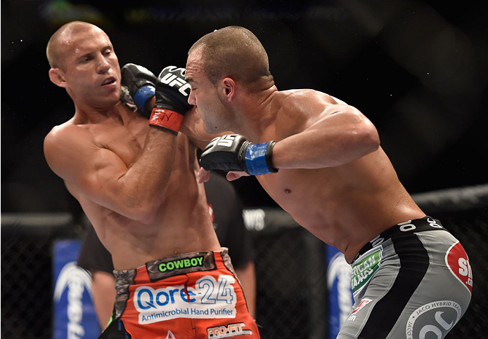 LAS VEGAS, NV - SEPTEMBER 27: (R-L) Eddie Alvarez punches Donald Cerrone in their lightweight fight during the UFC 178 event inside the MGM Grand Garden Arena on September 27, 2014 in Las Vegas, Nevada. (Photo by Jeff Bottari/Zuffa LLC/Zuffa LLC via Get