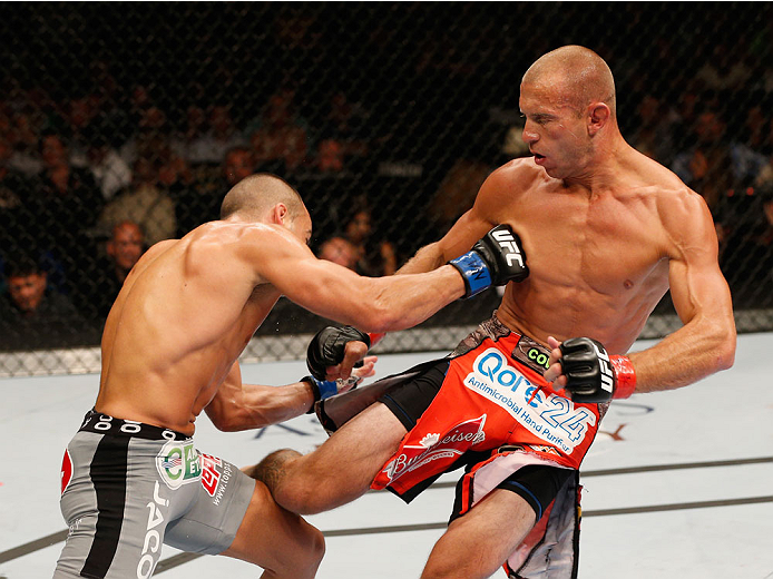 LAS VEGAS, NV - SEPTEMBER 27: (R-L) Donald Cerrone kicks Eddie Alvarez in their lightweight fight during the UFC 178 event inside the MGM Grand Garden Arena on September 27, 2014 in Las Vegas, Nevada. (Photo by Josh Hedges/Zuffa LLC/Zuffa LLC via Getty