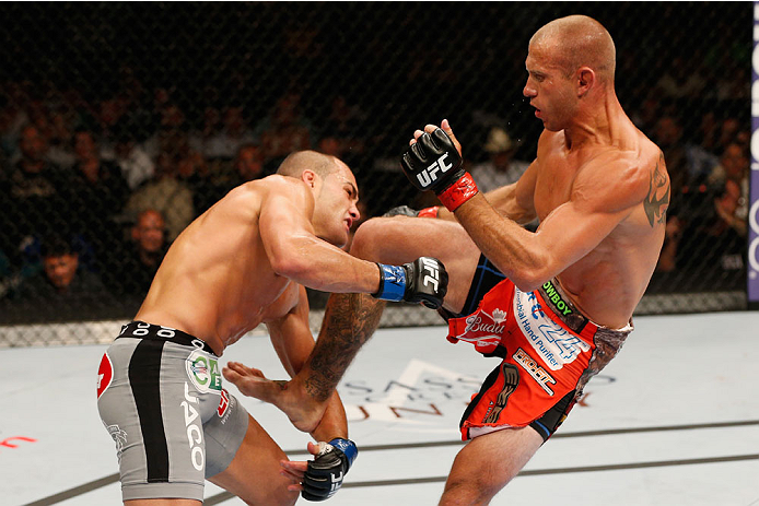 LAS VEGAS, NV - SEPTEMBER 27: (R-L) Donald Cerrone knees Eddie Alvarez in their lightweight fight during the UFC 178 event inside the MGM Grand Garden Arena on September 27, 2014 in Las Vegas, Nevada. (Photo by Josh Hedges/Zuffa LLC/Zuffa LLC via Getty