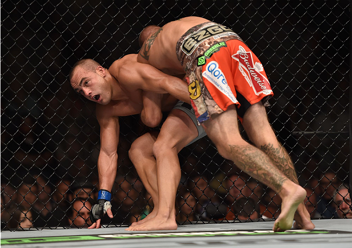 LAS VEGAS, NV - SEPTEMBER 27: (R-L) Donald Cerrone pushes Eddie Alvarez against the cage in their lightweight fight during the UFC 178 event inside the MGM Grand Garden Arena on September 27, 2014 in Las Vegas, Nevada. (Photo by Jeff Bottari/Zuffa LLC/Z