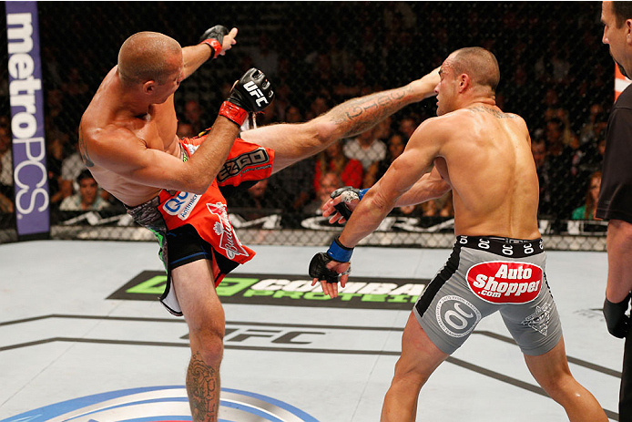 LAS VEGAS, NV - SEPTEMBER 27: (L-R) Donald Cerrone kicks Eddie Alvarez in their lightweight fight during the UFC 178 event inside the MGM Grand Garden Arena on September 27, 2014 in Las Vegas, Nevada. (Photo by Josh Hedges/Zuffa LLC/Zuffa LLC via Getty