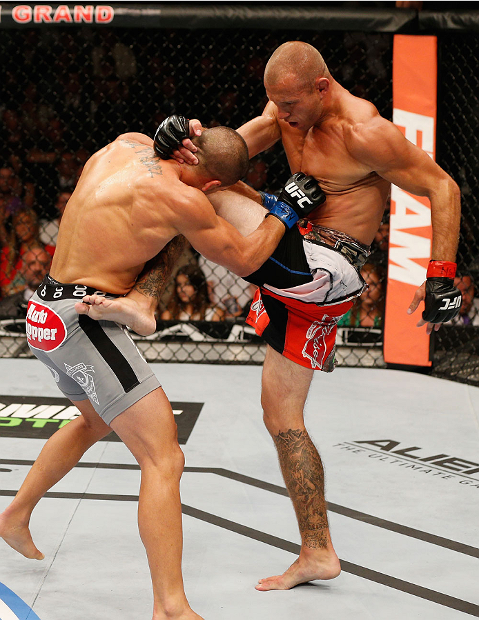 LAS VEGAS, NV - SEPTEMBER 27: (R-L) Donald Cerrone knees Eddie Alvarez in their lightweight fight during the UFC 178 event inside the MGM Grand Garden Arena on September 27, 2014 in Las Vegas, Nevada. (Photo by Josh Hedges/Zuffa LLC/Zuffa LLC via Getty