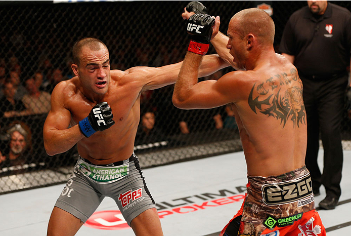 LAS VEGAS, NV - SEPTEMBER 27: (L-R) Eddie Alvarez punches Donald Cerrone in their lightweight fight during the UFC 178 event inside the MGM Grand Garden Arena on September 27, 2014 in Las Vegas, Nevada. (Photo by Josh Hedges/Zuffa LLC/Zuffa LLC via Gett