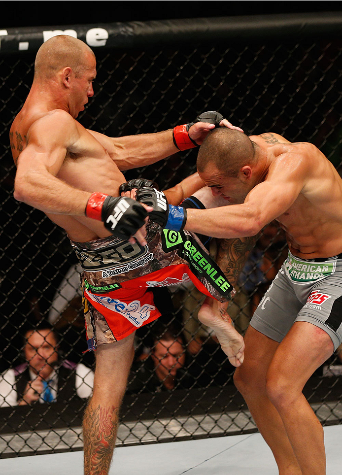 LAS VEGAS, NV - SEPTEMBER 27: (L-R) Donald Cerrone knees Eddie Alvarez in their lightweight fight during the UFC 178 event inside the MGM Grand Garden Arena on September 27, 2014 in Las Vegas, Nevada. (Photo by Josh Hedges/Zuffa LLC/Zuffa LLC via Getty