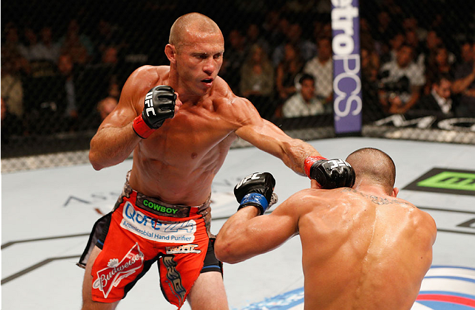 LAS VEGAS, NV - SEPTEMBER 27: (L-R) Donald Cerrone punches Eddie Alvarez in their lightweight fight during the UFC 178 event inside the MGM Grand Garden Arena on September 27, 2014 in Las Vegas, Nevada. (Photo by Josh Hedges/Zuffa LLC/Zuffa LLC via Gett