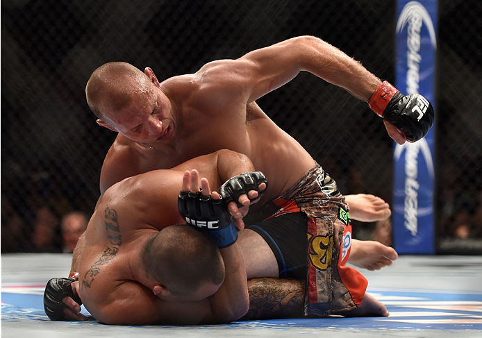LAS VEGAS, NV - SEPTEMBER 27: (Top) Donald Cerrone punches Eddie Alvarez in their lightweight fight during the UFC 178 event inside the MGM Grand Garden Arena on September 27, 2014 in Las Vegas, Nevada. (Photo by Jeff Bottari/Zuffa LLC/Zuffa LLC via Get