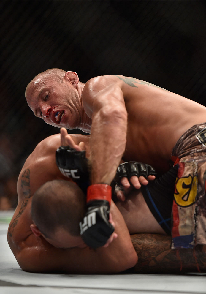 LAS VEGAS, NV - SEPTEMBER 27: (Top) Donald Cerrone punches Eddie Alvarez in their lightweight fight during the UFC 178 event inside the MGM Grand Garden Arena on September 27, 2014 in Las Vegas, Nevada. (Photo by Jeff Bottari/Zuffa LLC/Zuffa LLC via Get