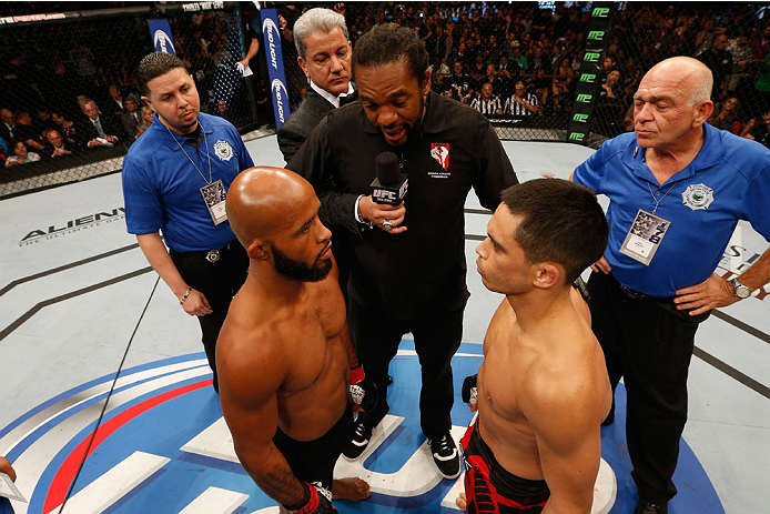 LAS VEGAS, NV - SEPTEMBER 27: UFC Flyweight champion Demetrious Johnson faces off with challenger Chris Cariaso in their flyweight championship fight during the UFC 178 event inside the MGM Grand Garden Arena on September 27, 2014 in Las Vegas, Nevada.