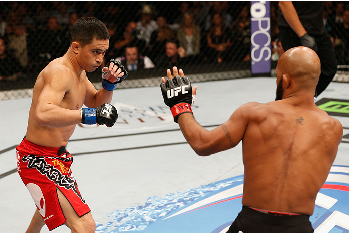 LAS VEGAS, NV - SEPTEMBER 27: (L-R) Chris Cariaso squares off with Demetrious Johnson in their flyweight championship fight during the UFC 178 event inside the MGM Grand Garden Arena on September 27, 2014 in Las Vegas, Nevada. (Photo by Josh Hedges/Zuff
