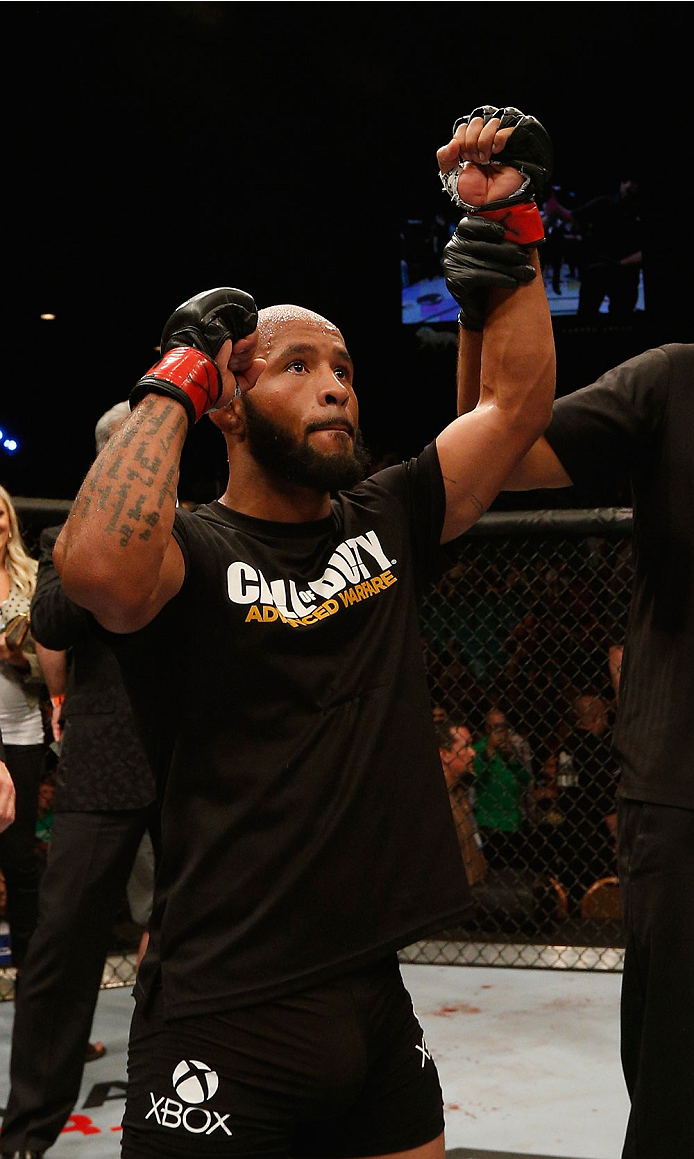 LAS VEGAS, NV - SEPTEMBER 27: UFC Flyweight champion Demetrious Johnson celebrates after his win over Chris Cariaso after their flyweight championship fight during the UFC 178 event inside the MGM Grand Garden Arena on September 27, 2014 in Las Vegas, Ne