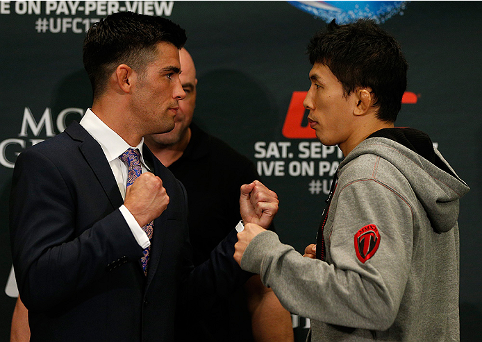 LAS VEGAS, NV - SEPTEMBER 25: (L-R) Opponents Dominick Cruz and Takeya Mizugaki of Japan face off during the UFC 178 Ultimate Media Day at the MGM Grand Hotel/Casino on September 25, 2014 in Las Vegas, Nevada. (Photo by Josh Hedges/Zuffa LLC/Zuffa LLC vi