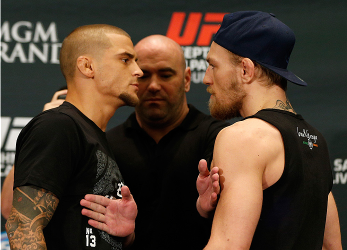 LAS VEGAS, NV - SEPTEMBER 25: (L-R) Opponents Dustin Poirier and Conor McGregor face off during the UFC 178 Ultimate Media Day at the MGM Grand Hotel/Casino on September 25, 2014 in Las Vegas, Nevada. (Photo by Josh Hedges/Zuffa LLC/Zuffa LLC via Getty I