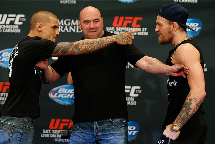 LAS VEGAS, NV - SEPTEMBER 25: (L-R) Opponents Dustin Poirier and Conor McGregor face off during the UFC 178 Ultimate Media Day at the MGM Grand Hotel/Casino on September 25, 2014 in Las Vegas, Nevada. (Photo by Josh Hedges/Zuffa LLC/Zuffa LLC via Getty I