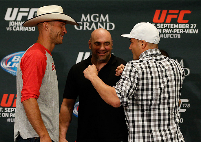 LAS VEGAS, NV - SEPTEMBER 25: (L-R) Opponents Donald "Cowboy" Cerrone and Eddie Alvarez face off during the UFC 178 Ultimate Media Day at the MGM Grand Hotel/Casino on September 25, 2014 in Las Vegas, Nevada. (Photo by Josh Hedges/Zuffa LLC/Zuffa LLC via