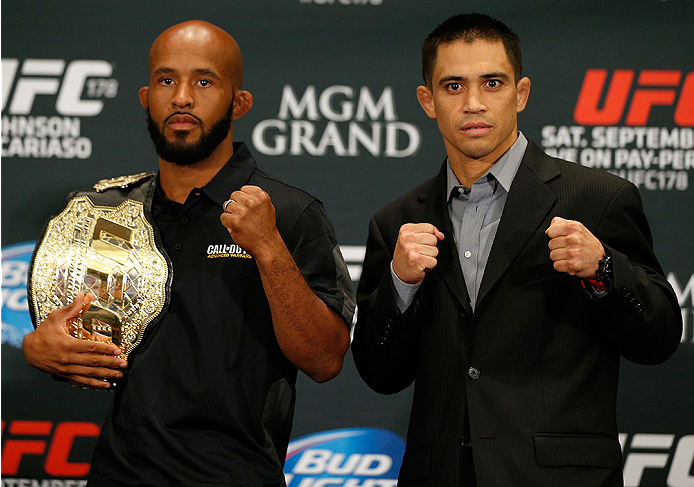 LAS VEGAS, NV - SEPTEMBER 25: (L-R) Opponents Demetrious Johnson and Chris Cariaso pose for photos during the UFC 178 Ultimate Media Day at the MGM Grand Hotel/Casino on September 25, 2014 in Las Vegas, Nevada. (Photo by Josh Hedges/Zuffa LLC/Zuffa LLC v