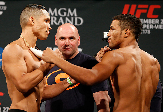 LAS VEGAS, NV - SEPTEMBER 26: (L-R) Opponents Jon Tuck of Guam and Kevin Lee face off during the UFC 178 weigh-in at the MGM Grand Conference Center on September 26, 2014 in Las Vegas, Nevada. (Photo by Josh Hedges/Zuffa LLC/Zuffa LLC via Getty Images)