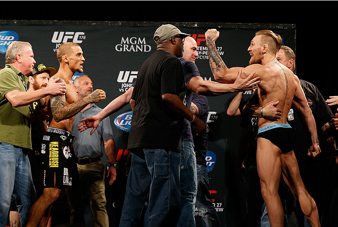 LAS VEGAS, NV - SEPTEMBER 26: (L-R) Opponents Dustin Poirier and Conor McGregor of Ireland face off during the UFC 178 weigh-in at the MGM Grand Conference Center on September 26, 2014 in Las Vegas, Nevada. (Photo by Josh Hedges/Zuffa LLC/Zuffa LLC via G