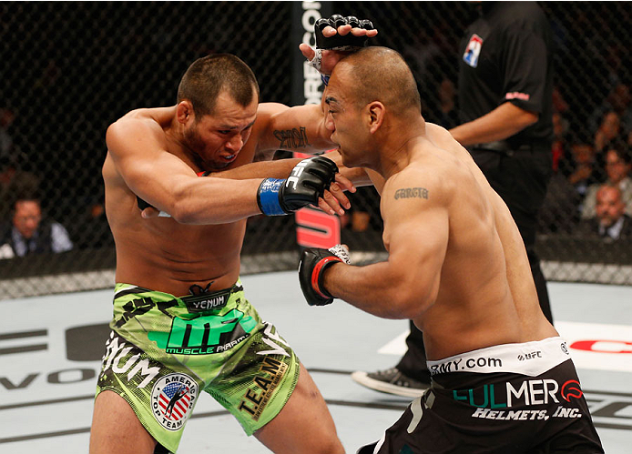 MEXICO CITY, MEXICO - NOVEMBER 15: (R-L) Edgar Garcia punches Hector Urbina in their welterweight bout during the UFC 180 event at Arena Ciudad de Mexico on November 15, 2014 in Mexico City, Mexico. (Photo by Josh Hedges/Zuffa LLC/Zuffa LLC via Getty Im