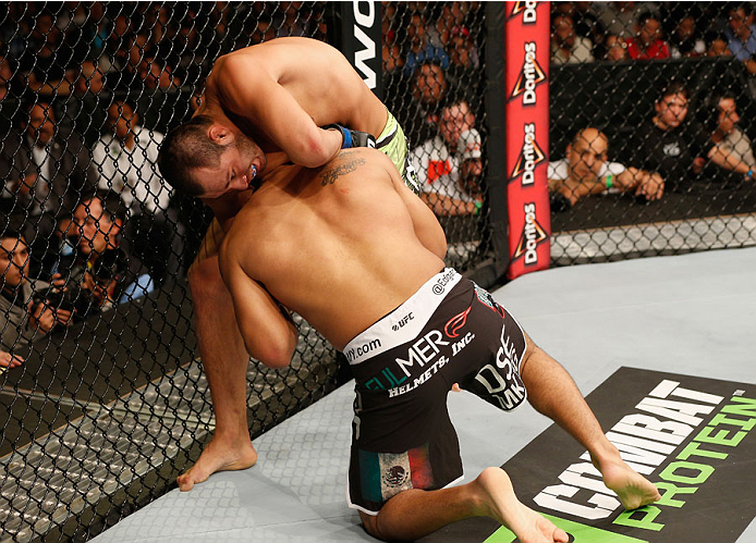 MEXICO CITY, MEXICO - NOVEMBER 15: Hector Urbina attempts to submit Edgar Garcia in their welterweight bout during the UFC 180 event at Arena Ciudad de Mexico on November 15, 2014 in Mexico City, Mexico. (Photo by Josh Hedges/Zuffa LLC/Zuffa LLC via Get