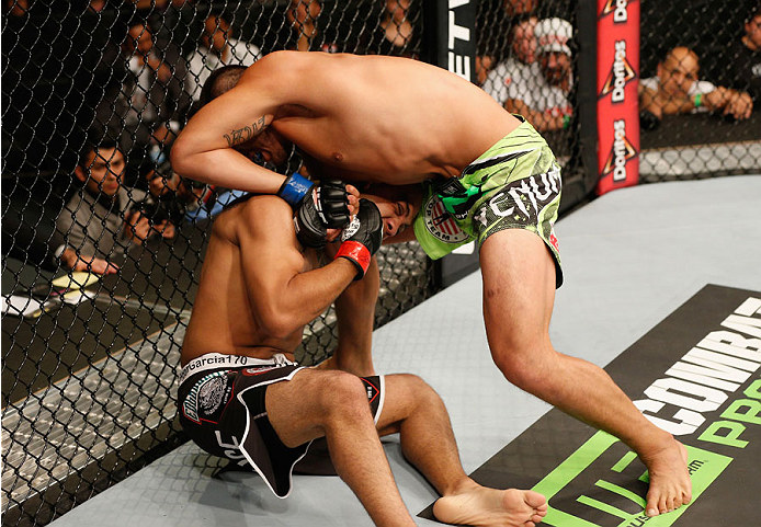 MEXICO CITY, MEXICO - NOVEMBER 15: Hector Urbina attempts to submit Edgar Garcia in their welterweight bout during the UFC 180 event at Arena Ciudad de Mexico on November 15, 2014 in Mexico City, Mexico. (Photo by Josh Hedges/Zuffa LLC/Zuffa LLC via Get
