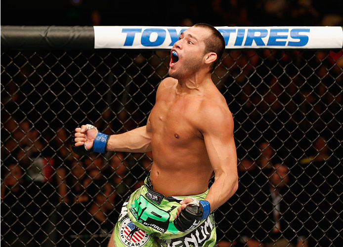 MEXICO CITY, MEXICO - NOVEMBER 15: Hector Urbina celebrates his submission victory over Edgar Garcia in their welterweight bout during the UFC 180 event at Arena Ciudad de Mexico on November 15, 2014 in Mexico City, Mexico. (Photo by Josh Hedges/Zuffa L