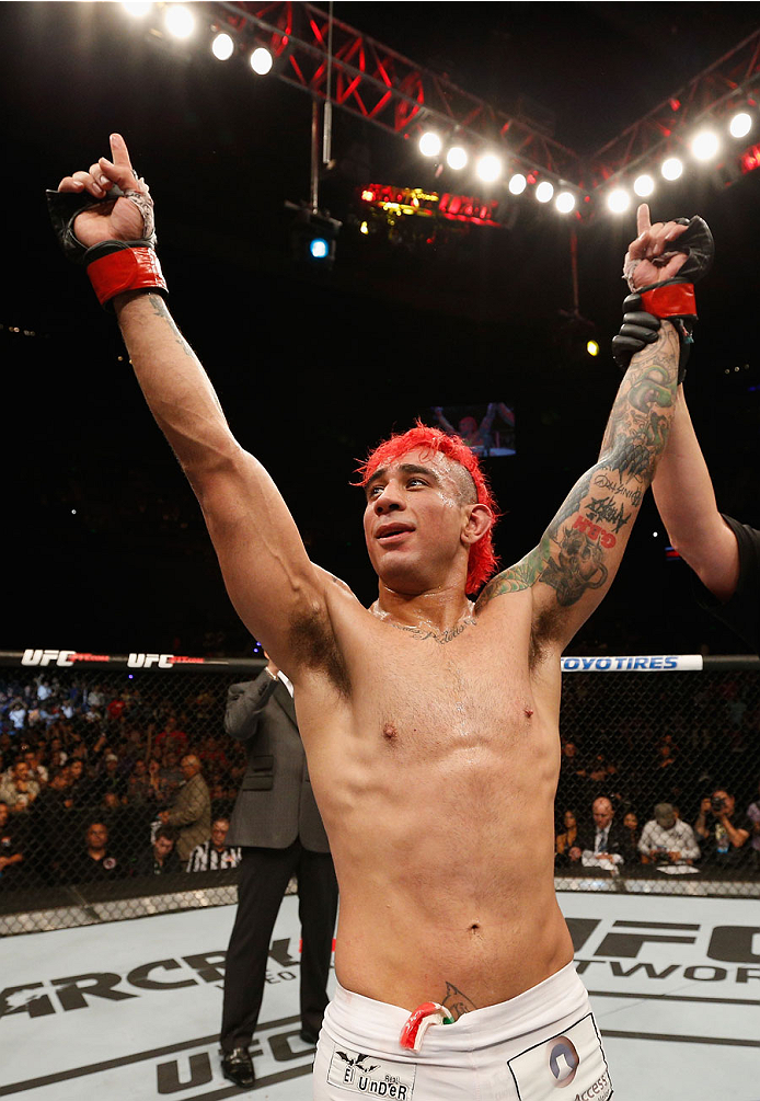 MEXICO CITY, MEXICO - NOVEMBER 15: Augusto Montano celebrates his TKO victory over Chris Heatherly in their welterweight bout during the UFC 180 event at Arena Ciudad de Mexico on November 15, 2014 in Mexico City, Mexico. (Photo by Josh Hedges/Zuffa LLC