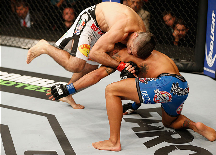 MEXICO CITY, MEXICO - NOVEMBER 15: (L-R) Ricardo Lamas attempts to submit Dennis Bermudez in their featherweight bout during the UFC 180 event at Arena Ciudad de Mexico on November 15, 2014 in Mexico City, Mexico. (Photo by Josh Hedges/Zuffa LLC/Zuffa L