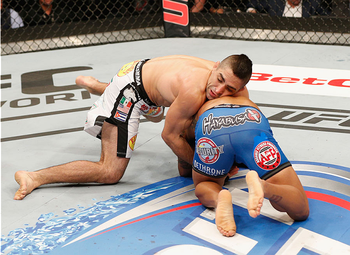 MEXICO CITY, MEXICO - NOVEMBER 15: (L-R) Ricardo Lamas attempts to submit Dennis Bermudez in their featherweight bout during the UFC 180 event at Arena Ciudad de Mexico on November 15, 2014 in Mexico City, Mexico. (Photo by Josh Hedges/Zuffa LLC/Zuffa L