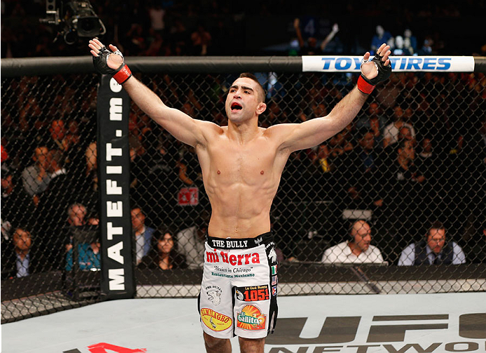 MEXICO CITY, MEXICO - NOVEMBER 15: Ricardo Lamas celebrates his submission victory over Dennis Bermudez in their featherweight bout during the UFC 180 event at Arena Ciudad de Mexico on November 15, 2014 in Mexico City, Mexico. (Photo by Josh Hedges/Zuf