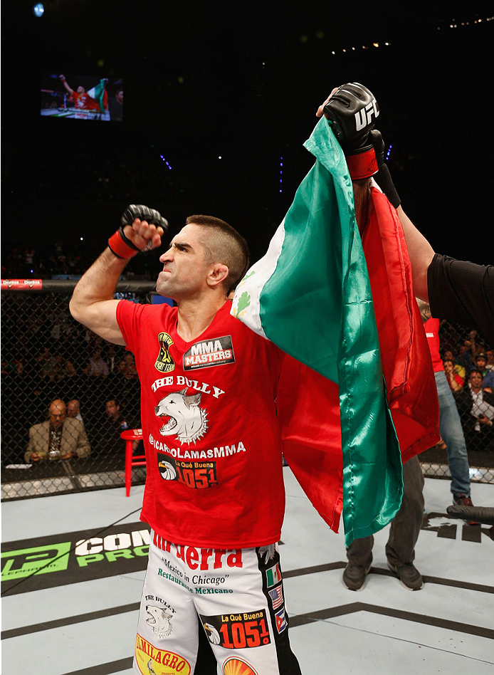 MEXICO CITY, MEXICO - NOVEMBER 15: Ricardo Lamas celebrates his submission victory over Dennis Bermudez in their featherweight bout during the UFC 180 event at Arena Ciudad de Mexico on November 15, 2014 in Mexico City, Mexico. (Photo by Josh Hedges/Zuf