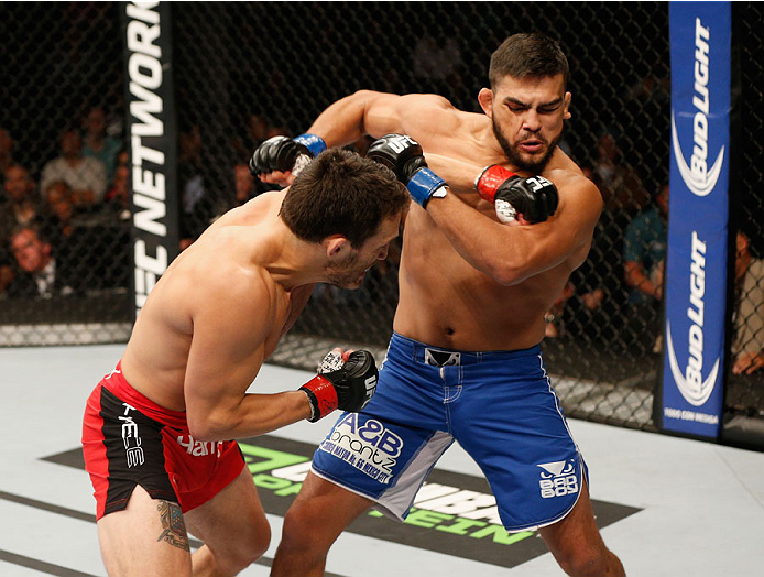 MEXICO CITY, MEXICO - NOVEMBER 15: (L-R) Jake Ellenberger punches Kelvin Gastelum in their welterweight bout during the UFC 180 event at Arena Ciudad de Mexico on November 15, 2014 in Mexico City, Mexico. (Photo by Josh Hedges/Zuffa LLC/Zuffa LLC via Ge