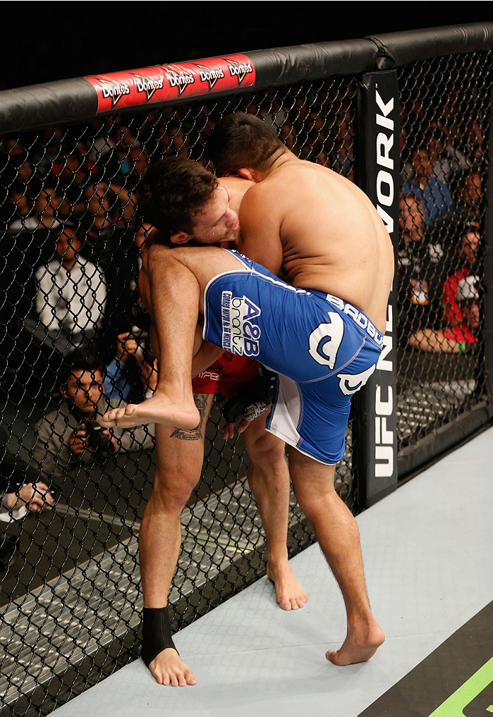MEXICO CITY, MEXICO - NOVEMBER 15: (R-L) Kelvin Gastelum knees Jake Ellenberger in their welterweight bout during the UFC 180 event at Arena Ciudad de Mexico on November 15, 2014 in Mexico City, Mexico. (Photo by Josh Hedges/Zuffa LLC/Zuffa LLC via Gett