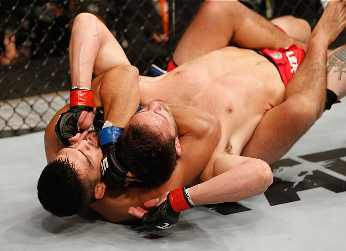 MEXICO CITY, MEXICO - NOVEMBER 15: (L-R) Kelvin Gastelum submits Jake Ellenberger in their welterweight bout during the UFC 180 event at Arena Ciudad de Mexico on November 15, 2014 in Mexico City, Mexico. (Photo by Josh Hedges/Zuffa LLC/Zuffa LLC via Ge