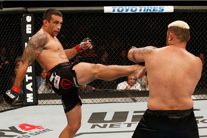 MEXICO CITY, MEXICO - NOVEMBER 15: (L-R) Fabricio Werdum kicks Mark Hunt in their interim UFC heavyweight championship bout during the UFC 180 event at Arena Ciudad de Mexico on November 15, 2014 in Mexico City, Mexico. (Photo by Josh Hedges/Zuffa LLC/Z