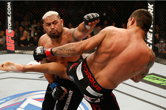 MEXICO CITY, MEXICO - NOVEMBER 15: (R-L) Fabricio Werdum and Mark Hunt trade strikes in their interim UFC heavyweight championship bout during the UFC 180 event at Arena Ciudad de Mexico on November 15, 2014 in Mexico City, Mexico. (Photo by Josh Hedges