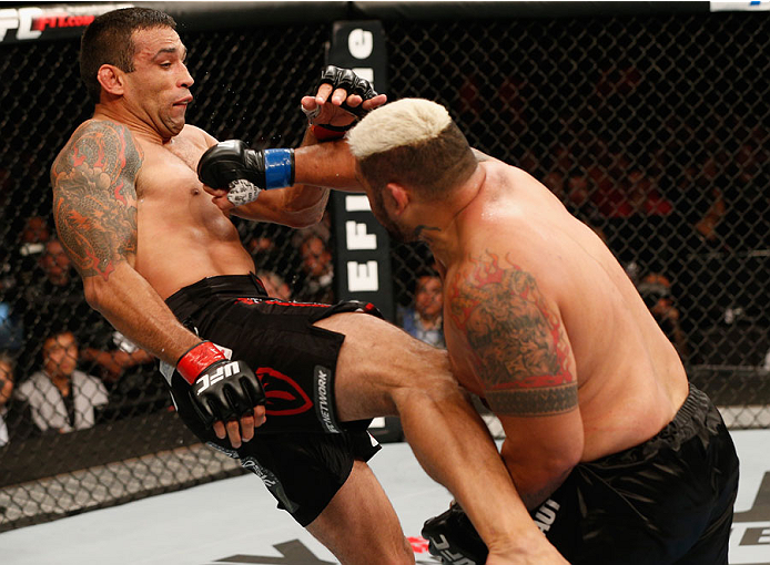 MEXICO CITY, MEXICO - NOVEMBER 15: (R-L) Mark Hunt punches Fabricio Werdum in their interim UFC heavyweight championship bout during the UFC 180 event at Arena Ciudad de Mexico on November 15, 2014 in Mexico City, Mexico. (Photo by Josh Hedges/Zuffa LLC