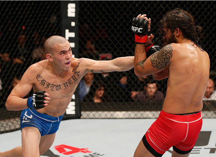 MEXICO CITY, MEXICO - NOVEMBER 15: (L-R) Marlon Vera punches Marco Beltra in their bantamweight bout during the UFC 180 event at Arena Ciudad de Mexico on November 15, 2014 in Mexico City, Mexico. (Photo by Josh Hedges/Zuffa LLC/Zuffa LLC via Getty Imag